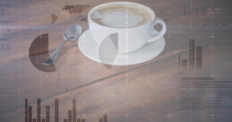 Sitting white ceramic coffee cup on saucer with metal teaspoon at office table, with data overlays