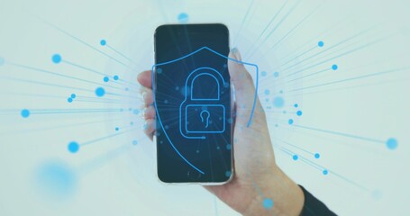 Holding female hand wearing dark sleeve, showing smartphone in studio with padlock shield network