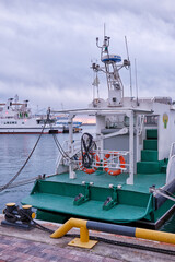 Fototapeta premium The stern of a boat with red lifebuoys in Sochi Harbor. Krasnodar Krai, Russia.