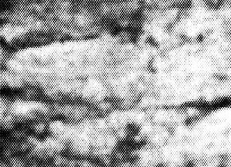 Extreme macro of black printer halftone dots forming layered cloud shapes with dark sky patches and soft tonal gradient, isolated on a transparent background