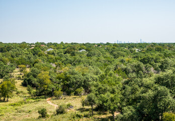 View across a wildlife reserve towards downtown Austin in Texas at the Lady Bird Johnson wildflower center
