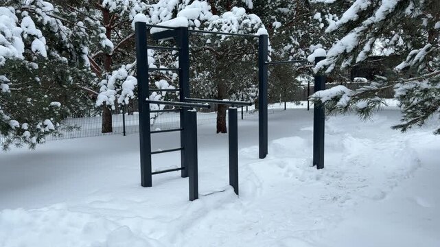 Outdoor Workout Station Covered in Thick Winter Snow