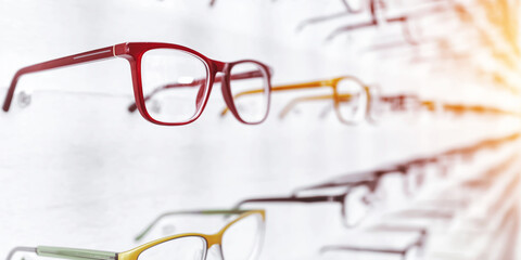 Eyewear frames on display in a modern optical shop, showing new collection of stylish spectacles