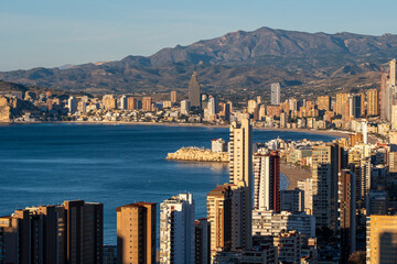 benidorm spain mediterranean coastline skyline cityscape in daylight with sea mountains and bay showing a bright panoramic view of the resort