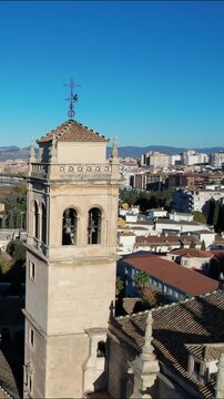 Aerial view of Granada Cathedral bell tower during the daytime in Spain showcasing architecture and city skyline