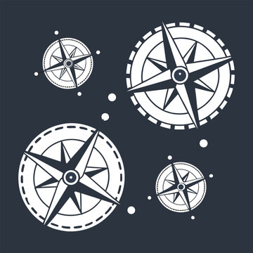 Set of nautical compass rose icons, vintage maritime navigation symbols, wind rose vector illustrations isolated on dark background.
