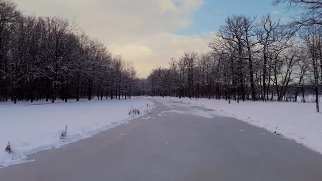 Low Drone Flight Over Snowy Water