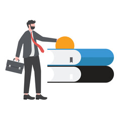 Businessman in suit holding briefcase standing beside large books