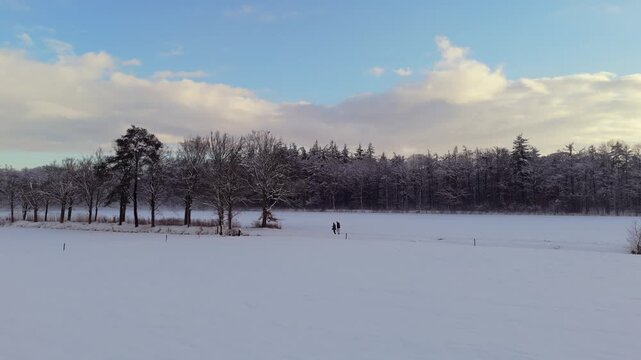 Hikers in a White Winter Landscape