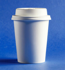White Disposable Coffee Cup with Lid on Blue Background, Studio Shot