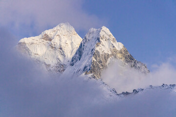 Ama Dablam mountain summit, famous mountain view in Himalaya mountains, Nepal. Everest Base Camp trek beautiful landscape view of snow high altitude summit and glacier. AmaDablam classic view