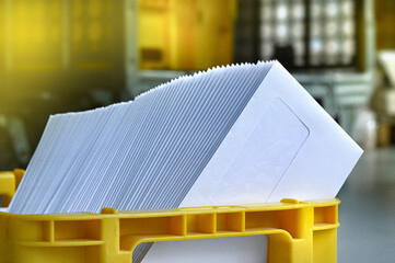 Mailbox with letter mailing sorted by zip code for delivery and postage optimization when sending mail. Inserting machine mail letter print production business.