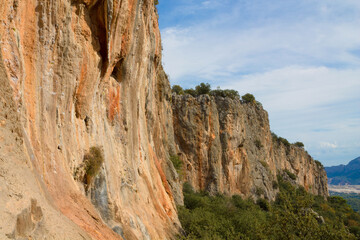 Rock climbing crag area in Geyikbayiri, Turkey. Rock climbing spot near Antalya. Geyikbayiri rockclimbing area crag in Turkey. Tuffa rock walls and caves spectacular view landscape Spectacular Cave
