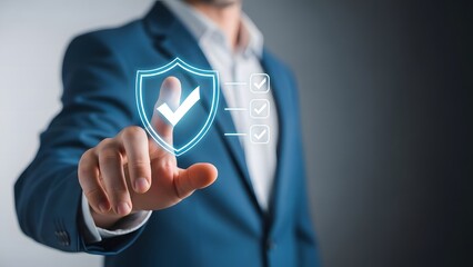 Businessman interacting with a digital shield and checkmark icon for cybersecurity or data protection