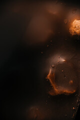 Abstract chocolate texture with dark moody background and copy space