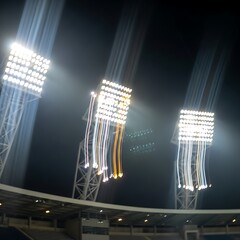 Stadium floodlights illuminating night sky