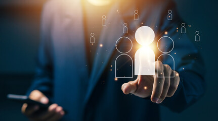 Business professional selecting highlighted user icon on digital interface, representing talent selection, workforce targeting, recruitment decision, human resource strategy.