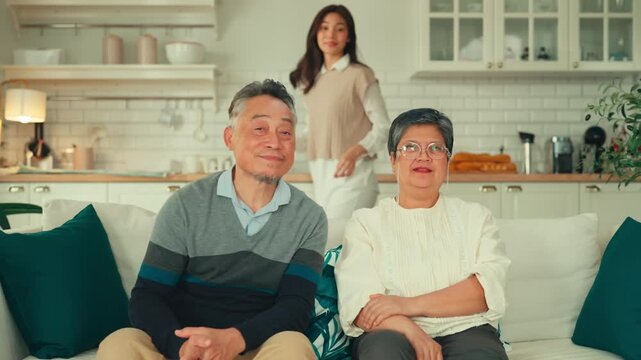 mother day happiness asian family candid of daughter hug mother farther senior elder cozy relax on sofa couch surprise visiting in living room at home,together hug cheerful love asian family at home 