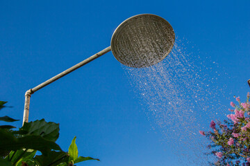 Shower in a leisure area of ​​a residence in Guarani, Minas Gerais state, Brazil. © Ronaldo Almeida