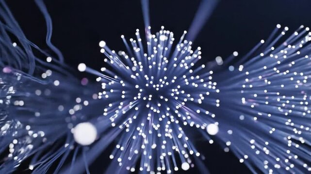 Abstract glowing fiber optics network with luminous particles on dark background.