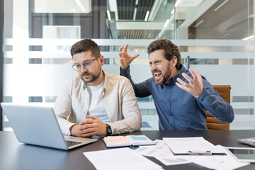 Frustrated boss or colleague yelling at a stressed employee in a modern office, depicting workplace conflict, high pressure, emotional stress, and a challenging work environment