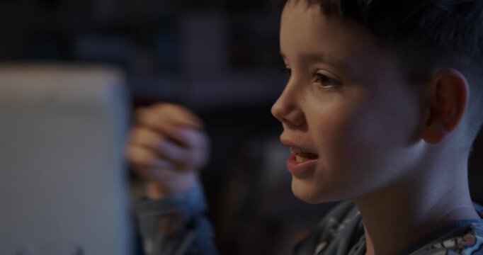 A close-up of a boy explaining his theory about who the imposter is in the match.