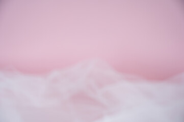 Soft pink background with ethereal tulle fabric texture. Abstract romantic backdrop with copy space for Valentine's Day, wedding, or beauty products