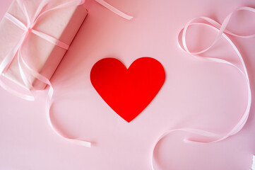 Red heart on a pink background. Valentine's Day celebration concept