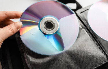 Bunch of CD and DVD discs organized in a disc holder.