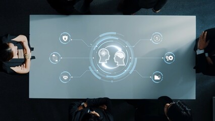 A modern business meeting featuring a high-tech digital interface presenting data visuals, illustrating teamwork and strategic planning in a collaborative environment. Raster