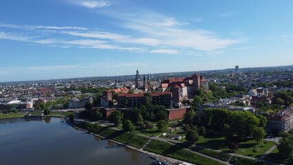 Fototapeta premium Aerial view of historic architecture and urban landscape in Poland, showcasing European cityscape, river and landmarks.