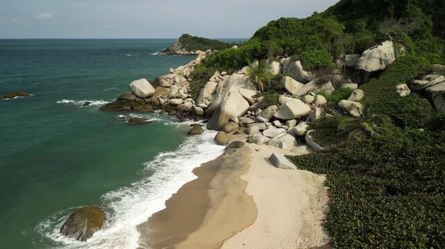 Expansive aerial of untouched Caribbean coastline at Playa Arrecifes inside Tayrona National Natural Park.