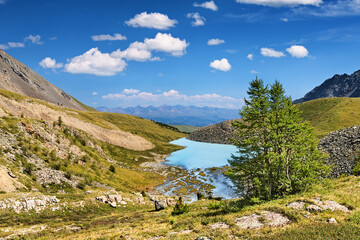 Beautiful mountain landscape with small lake and blue sky