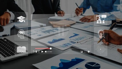 A diverse group of professionals engages in a business meeting, surrounded by charts and data sheets, embodying collaboration, strategy, and innovation in a modern office. Raster