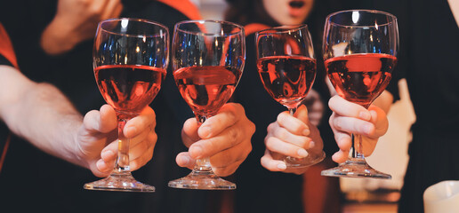 Friends enjoying a Halloween party at a bar making a toast