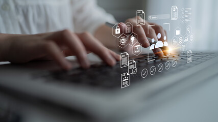 A focused scene showing hands typing on a laptop, accompanied by digital icons that illustrate themes of technology, communication, and data management in a modern workspace. Gantry