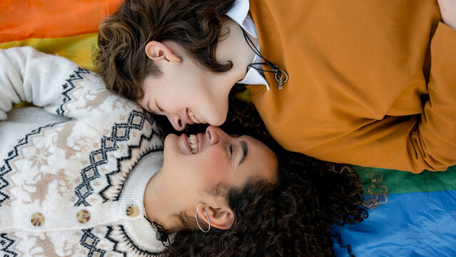 Young lesbian couple celebrating love and pride