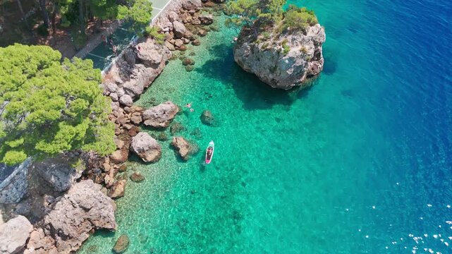 Panoramic Drone Shot of Brela Coastline and Famous Rock Landmark in Summer.