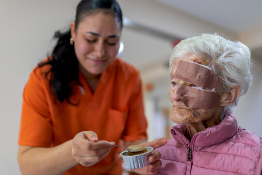 Caring for an elderly woman with facial wounds