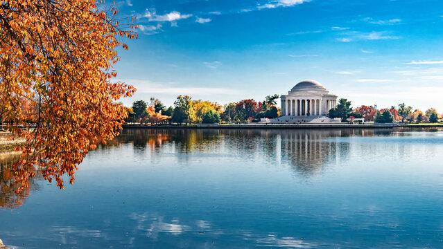 Fall foliage and calm water at Tidal Basin with Jefferson Memorial Washington DC