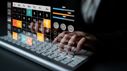 A close-up view of hands typing on a keyboard, featuring an overlay of a calendar and data visualization. This image represents modern business and time management strategies. Gantry