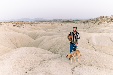 Blind man in desert with guide dog exemplifies resilience