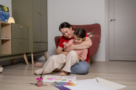 Mother and daughter enjoying creative time at home