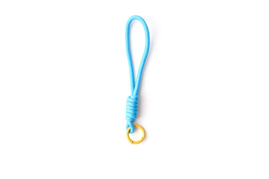 Blue paracord keychain lanyard with yellow metal ring isolated on white background. Minimalist EDC accessory for keys and outdoor gear. Durable braided rope loop for security and organization