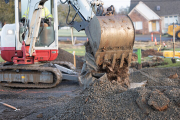 Heavy machinery dumping gravel