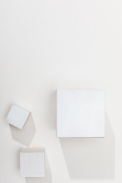 White cubes on white surface