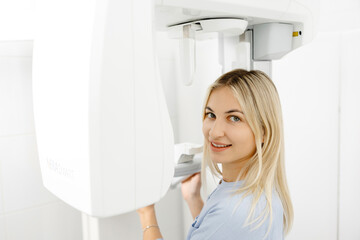 Young woman undergoing a dental panoramic radiography exam