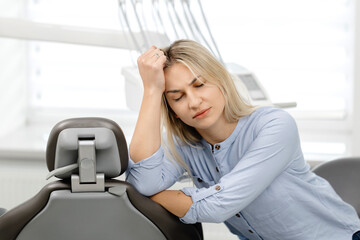 Patient suffering from toothache waiting for dentist in clinic