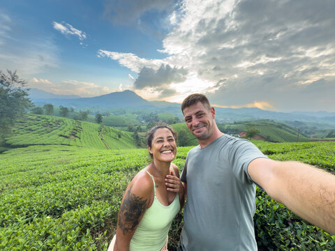 Couple enjoying tea plantations in Long Coc, Vietnam