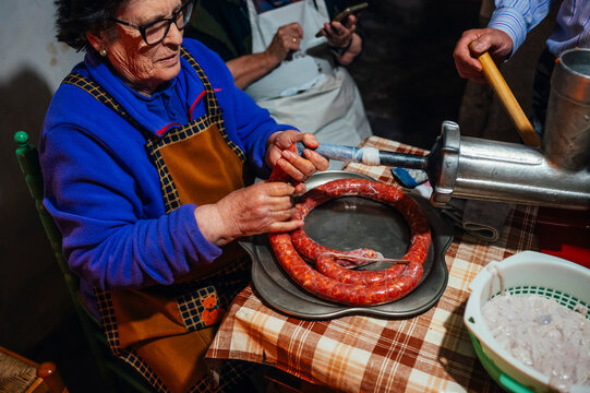 Traditional preparation of chorizo in a rural setting
